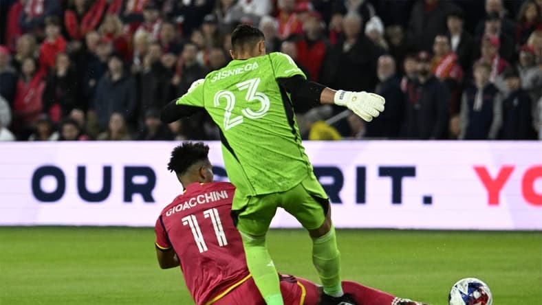 Mar 4, 2023; St. Louis, Missouri, USA; St. Louis City forward Nicholas Gioacchini (11) tackles the ball away from Charlotte FC goalkeeper Pablo Sisniega (23) in the first half at CITYPARK. Mandatory Credit: Scott Rovak-USA TODAY Sports