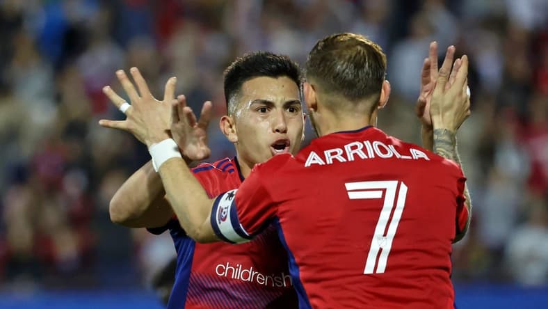 Mar 4, 2023; Frisco, Texas, USA; FC Dallas forward Alan Velasco (20) celebrates with forward Paul Arriola (7) after scoring a goal against the Los Angeles Galaxy during the first half at Toyota Stadium. Mandatory Credit: Kevin Jairaj-USA TODAY Sports