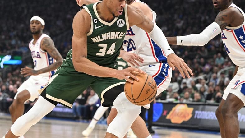 Mar 4, 2023; Milwaukee, Wisconsin, USA; Milwaukee Bucks forward Giannis Antetokounmpo (34) drives to the basket against Philadelphia 76ers forward Georges Niang (20) in the first half at Fiserv Forum. Mandatory Credit: Michael McLoone-USA TODAY Sports