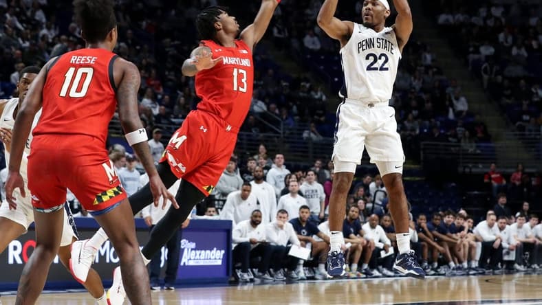 Mar 5, 2023; University Park, Pennsylvania, USA; Penn State Nittany Lions guard Jalen Pickett (22) shoots the ball as Maryland Terrapins guard Hakim Hart (13) defends during the first half at Bryce Jordan Center. Mandatory Credit: Matthew OHaren-USA TODAY Sports