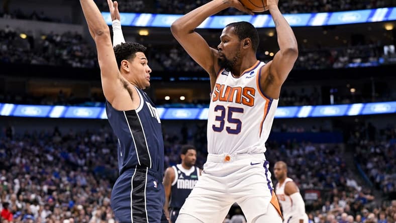 Mar 5, 2023; Dallas, Texas, USA; Phoenix Suns forward Kevin Durant (35) looks to pass the ball around Dallas Mavericks guard Josh Green (8) during the first quarter at the American Airlines Center. Mandatory Credit: Jerome Miron-USA TODAY Sports