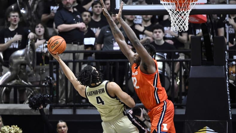 Mar 5, 2023; West Lafayette, Indiana, USA; Purdue Boilermakers forward Trey Kaufman-Renn (4) shoots the ball from under Illinois Fighting Illini forward Dain Dainja (42) during the first half at Mackey Arena. Mandatory Credit: Marc Lebryk-USA TODAY Sports