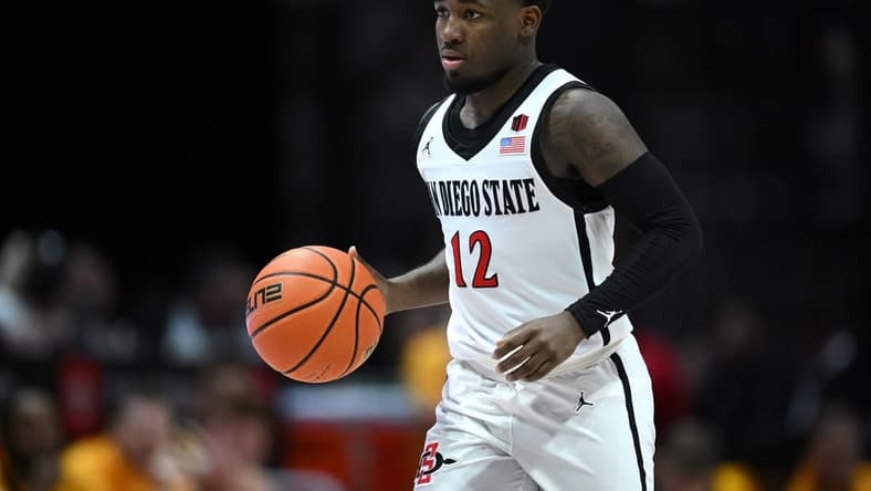 Mar 4, 2023; San Diego, California, USA; San Diego State Aztecs guard Darrion Trammell (12) dribbles the ball during the second half against the Wyoming Cowboys at Viejas Arena. Mandatory Credit: Orlando Ramirez-USA TODAY Sports