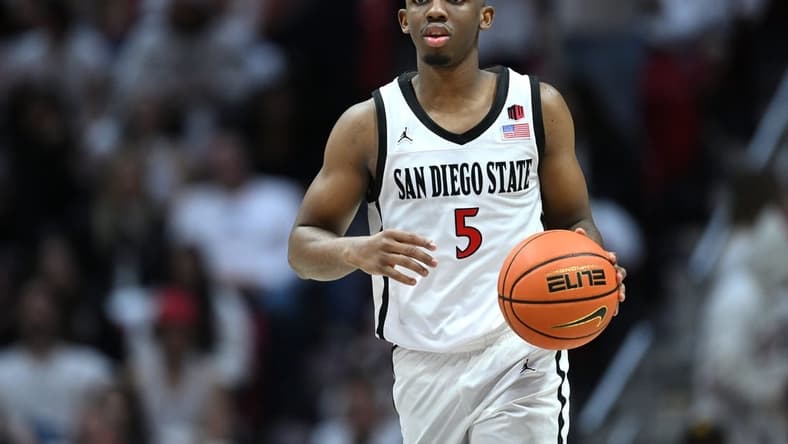 Mar 4, 2023; San Diego, California, USA; San Diego State Aztecs guard Lamont Butler (5) dribbles the ball during the second half against the Wyoming Cowboys at Viejas Arena. Mandatory Credit: Orlando Ramirez-USA TODAY Sports