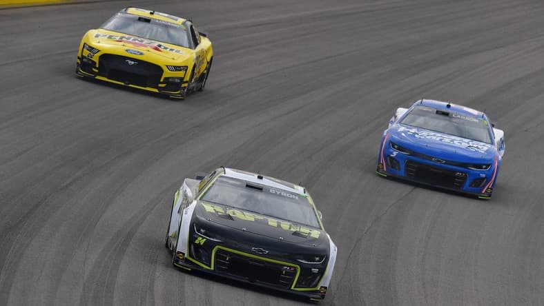 Mar 5, 2023; Las Vegas, Nevada, USA; NASCAR Cup Series driver William Byron (24) leads driver Joey Logano (22) and driver Kyle Larson (5) during the Pennzoil 400 at Las Vegas Motor Speedway. Mandatory Credit: Gary A. Vasquez-USA TODAY Sports