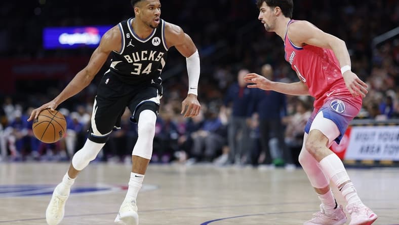 Mar 5, 2023; Washington, District of Columbia, USA; Milwaukee Bucks forward Giannis Antetokounmpo (34) drives to the basket as Washington Wizards forward Corey Kispert (24) defends in the fourth quarter at Capital One Arena. Mandatory Credit: Geoff Burke-USA TODAY Sports