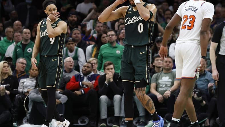 Mar 5, 2023; Boston, Massachusetts, USA; Boston Celtics forward Jayson Tatum (0) and guard Derrick White (9) react to a foul being called against the Celtics during the overtime period against the New York Knicks at TD Garden. Mandatory Credit: Winslow Townson-USA TODAY Sports