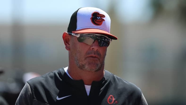 Mar 6, 2023; Sarasota, Florida, USA; Baltimore Orioles manager Brandon Hyde (18) looks on against the Philadelphia Phillies at Ed Smith Stadium. Mandatory Credit: Kim Klement-USA TODAY Sports