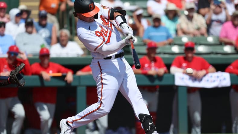 Mar 6, 2023; Sarasota, Florida, USA; Baltimore Orioles catcher Adley Rutschman (35) singles during the first inning at Ed Smith Stadium. Mandatory Credit: Kim Klement-USA TODAY Sports