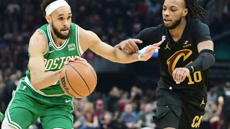 Mar 6, 2023; Cleveland, Ohio, USA; Boston Celtics guard Derrick White (9) drives to the basket against Cleveland Cavaliers guard Darius Garland (10) during the first half at Rocket Mortgage FieldHouse. Mandatory Credit: Ken Blaze-USA TODAY Sports