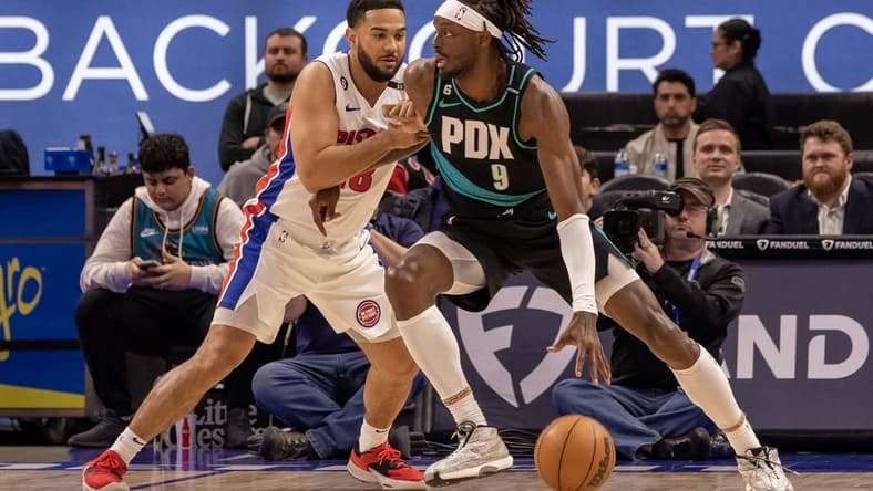 Mar 6, 2023; Detroit, Michigan, USA; Detroit Pistons guard Cory Joseph (18) defends against Portland Trail Blazers forward Jerami Grant (9) during the first quarter at Little Caesars Arena. Mandatory Credit: David Reginek-USA TODAY Sports