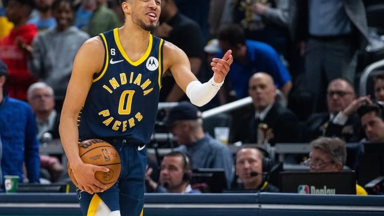 Mar 6, 2023; Indianapolis, Indiana, USA; Indiana Pacers guard Tyrese Haliburton (0) reacts to a call  in the second half against the Philadelphia 76ers at Gainbridge Fieldhouse. Mandatory Credit: Trevor Ruszkowski-USA TODAY Sports