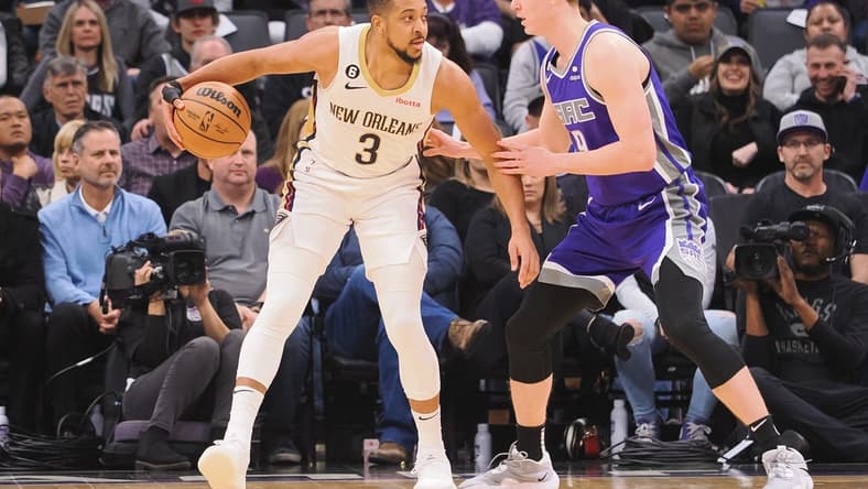 Mar 6, 2023; Sacramento, California, USA; New Orleans Pelicans shooting guard CJ McCollum (3) controls the ball against Sacramento Kings shooting guard Kevin Huerter (9) during the first quarter at Golden 1 Center. Mandatory Credit: Kelley L Cox-USA TODAY Sports