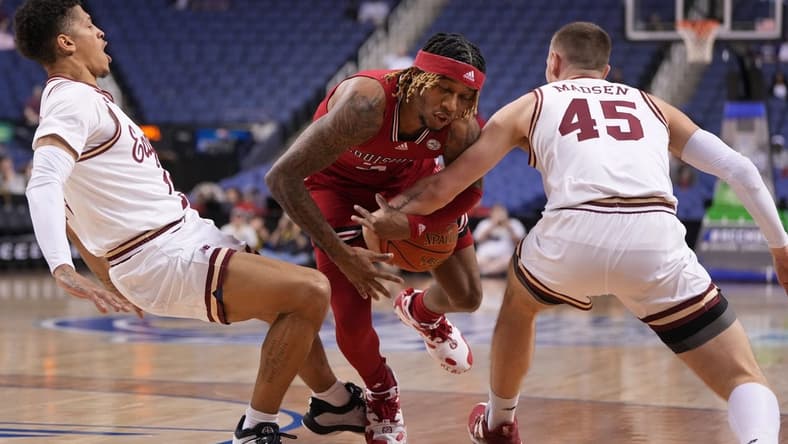 Mar 7, 2023; Greensboro, NC, USA; Louisville Cardinals guard El Ellis (3) with the ball as Boston College Eagles guard Makai Ashton-Langford (11) and guard Mason Madsen (45) defend in the first half of the first round of the ACC Tournament at Greensboro Coliseum. Mandatory Credit: Bob Donnan-USA TODAY Sports