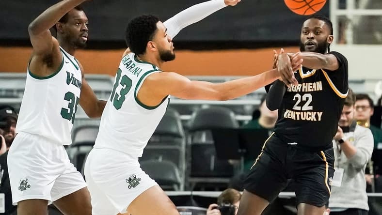 Mar 7, 2023; Indianapolis, IN, USA;  Northern Kentucky Norse guard Trevon Faulkner (22) passes the ball around Cleveland State Vikings forward Tristan Enaruna (13) during the first half at Indiana Farmers Coliseum. Mandatory Credit: Robert Goddin-USA TODAY Sports