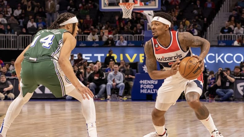 Mar 7, 2023; Detroit, Michigan, USA; Detroit Pistons guard R.J. Hampton (14) defends against Washington Wizards guard Bradley Beal (3) in the first quarter at Little Caesars Arena. Mandatory Credit: David Reginek-USA TODAY Sports