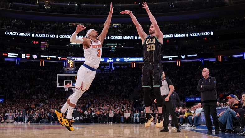 Mar 7, 2023; New York, New York, USA; Charlotte Hornets forward Gordon Hayward (20) shoots the ball against the New York Knicks against New York Knicks guard Josh Hart (3) during the first half at Madison Square Garden. Mandatory Credit: Vincent Carchietta-USA TODAY Sports