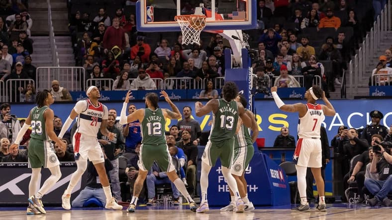Mar 7, 2023; Detroit, Michigan, USA; Washington Wizards center Daniel Gafford (21) shoots the game winning basket as time runs out against the Detroit Pistons in the fourth quarter at Little Caesars Arena. Mandatory Credit: David Reginek-USA TODAY Sports