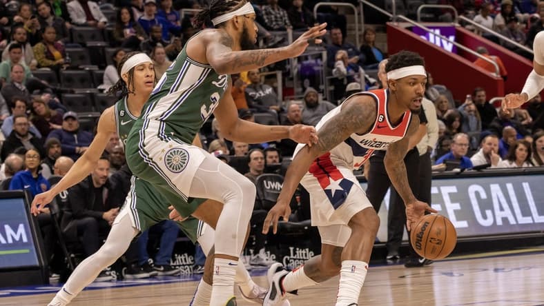 Mar 7, 2023; Detroit, Michigan, USA; Washington Wizards guard Bradley Beal (3) controls the ball in front of Detroit Pistons forward Marvin Bagley III (35) in the first quarter at Little Caesars Arena. Mandatory Credit: David Reginek-USA TODAY Sports