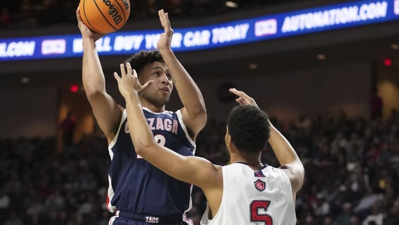 March 7, 2023; Las Vegas, NV, USA; Gonzaga Bulldogs forward Anton Watson (22) shoots the basketball against Saint Mary's Gaels forward Josh Jefferson (5) during the first half in the finals of the WCC Basketball Championships at Orleans Arena. Mandatory Credit: Kyle Terada-USA TODAY Sports
