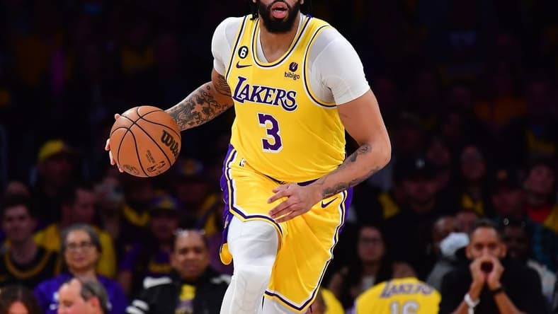 Mar 7, 2023; Los Angeles, California, USA; Los Angeles Lakers forward Anthony Davis (3) moves the ball up court against the Memphis Grizzlies during the first half at Crypto.com Arena. Mandatory Credit: Gary A. Vasquez-USA TODAY Sports
