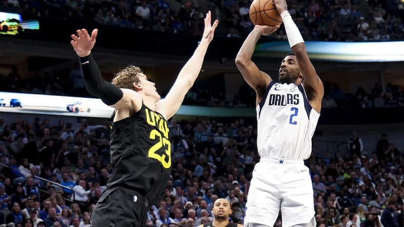 Mar 7, 2023; Dallas, Texas, USA;  Dallas Mavericks guard Kyrie Irving (2) shoots over Utah Jazz forward Lauri Markkanen (23) during the fourth quarter at American Airlines Center. Mandatory Credit: Kevin Jairaj-USA TODAY Sports