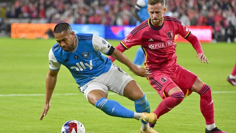 Mar 4, 2023; St. Louis, Missouri, USA; Charlotte FC defender Bill Tuiloma (6) and St. Louis City SC forward Rasmus Alm (21) battle for the ball during the second half at CITYPARK. Mandatory Credit: Jeff Curry-USA TODAY Sports