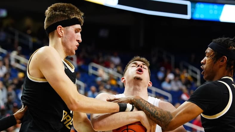 Mar 8, 2023; Greensboro, NC, USA; Syracuse Orange guard Joseph Girard III (11) battle for control of the ball against Wake Forest Demon Deacons forward Andrew Carr (11) and guard Lucas Taylor (0) during the first half of the second round of the ACC tournament at Greensboro Coliseum. Mandatory Credit: John David Mercer-USA TODAY Sports