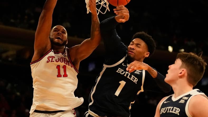 Mar 8, 2023; New York, NY, USA; Butler Bulldogs forward Jalen Thomas (1) blocks the shot of St. John's Red Storm center Joel Soriano (11) during the first half at Madison Square Garden. Mandatory Credit: Robert Deutsch-USA TODAY Sports