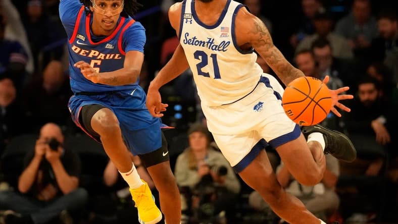 Mar 8, 2023; New York, NY, USA; Seton Hall Pirates guard Femi Odukale (21) controls the ball as DePaul Blue Demons guard Philmon Gebrewhit (5) defends during the first half at Madison Square Garden. Mandatory Credit: Robert Deutsch-USA TODAY Sports