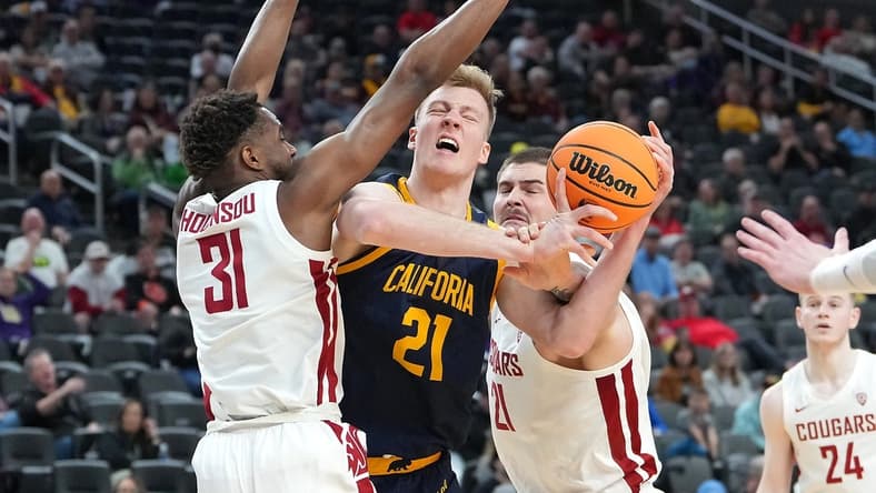 Mar 8, 2023; Las Vegas, NV, USA; Washington State Cougars guard Kymany Houinsou (31) and Washington State Cougars center Jack Wilson (21) defend against California Golden Bears forward Lars Thiemann (21) during the first half at T-Mobile Arena. Mandatory Credit: Stephen R. Sylvanie-USA TODAY Sports