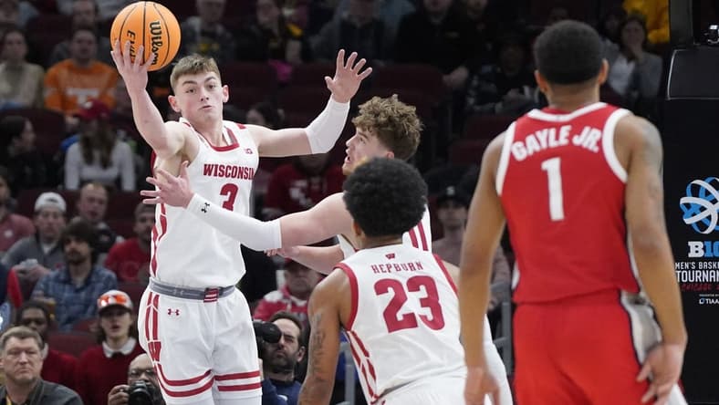 Mar 8, 2023; Chicago, IL, USA; Wisconsin Badgers guard Connor Essegian (3) grabs a rebound against the Ohio State Buckeyes during the first half at United Center. Mandatory Credit: David Banks-USA TODAY Sports