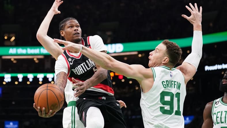 Mar 8, 2023; Boston, Massachusetts, USA; Portland Trail Blazers Cam Reddish (5) shoots against Boston Celtics forward Blake Griffin (91) in the first quarter at TD Garden. Mandatory Credit: David Butler II-USA TODAY Sports