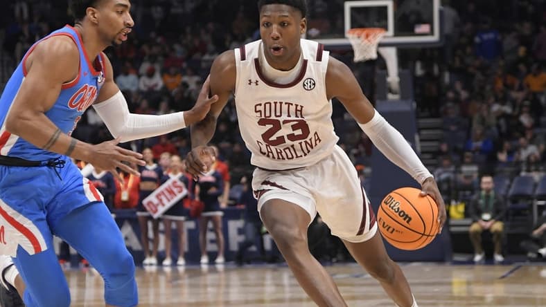 Mar 8, 2023; Nashville, TN, USA; South Carolina Gamecocks forward Gregory Jackson II (23) drives past Mississippi Rebels forward Myles Burns (3) during the second half at Bridgestone Arena. Mandatory Credit: Steve Roberts-USA TODAY Sports