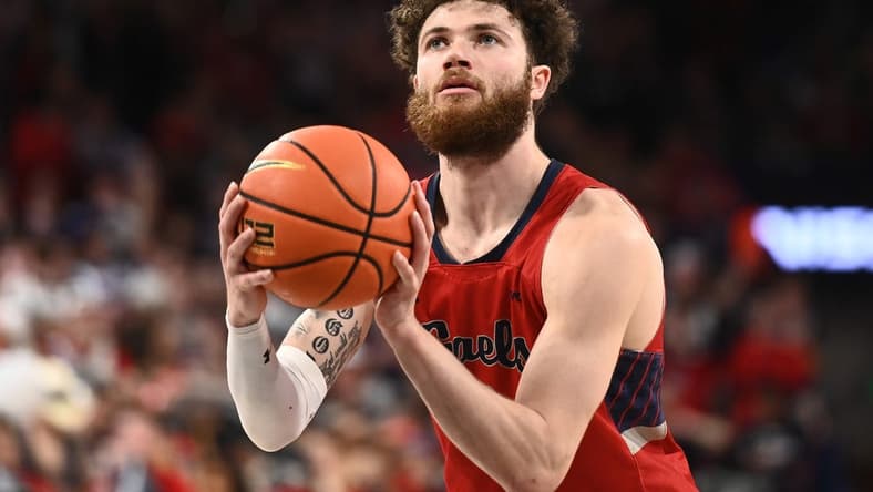 Feb 25, 2023; Spokane, Washington, USA; St. Mary's Gaels guard Logan Johnson (0) shoots the ball against the Gonzaga Bulldogs in the second half at McCarthey Athletic Center. Mandatory Credit: James Snook-USA TODAY Sports