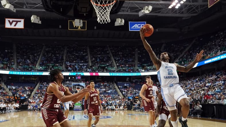 Mar 8, 2023; Greensboro, NC, USA; North Carolina Tar Heels guard Caleb Love (2) drives to the basket for a layup against the Boston College Eagle during the first half of the second round of the ACC tournament at Greensboro Coliseum. Mandatory Credit: John David Mercer-USA TODAY Sports
