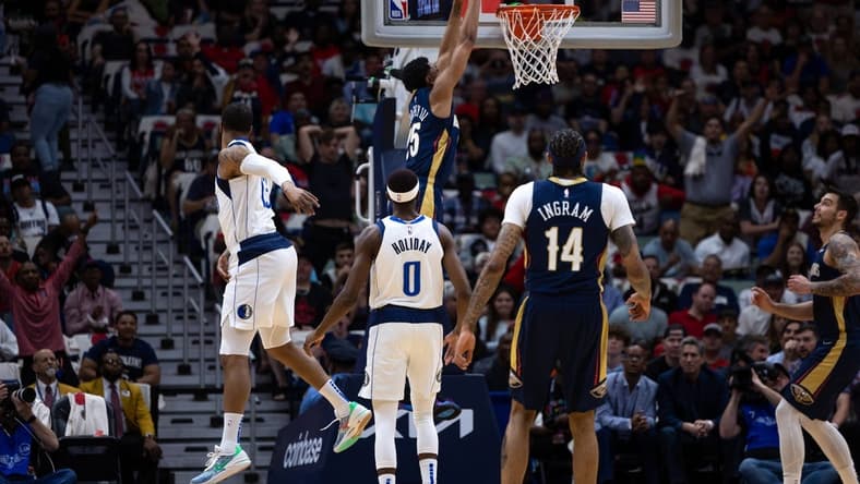 Mar 8, 2023; New Orleans, Louisiana, USA; New Orleans Pelicans guard Trey Murphy III (25) dunks the ball against Dallas Mavericks forward Markieff Morris (13) during the first half at Smoothie King Center. Mandatory Credit: Stephen Lew-USA TODAY Sports