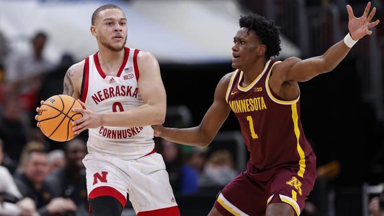 Mar 8, 2023; Chicago, IL, USA; Nebraska Cornhuskers guard C.J. Wilcher (0) looks to pass the ball against Minnesota Golden Gophers forward Joshua Ola-Joseph (1) during the first half at United Center. Mandatory Credit: Kamil Krzaczynski-USA TODAY Sports