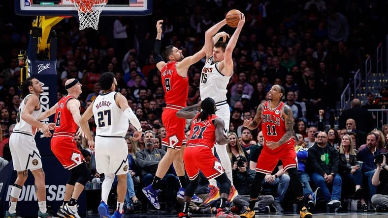 Mar 8, 2023; Denver, Colorado, USA; Denver Nuggets center Nikola Jokic (15) grabs a rebound against Chicago Bulls center Nikola Vucevic (9) as guard Patrick Beverley (21) and forward DeMar DeRozan (11) and guard Jamal Murray (27) and guard Alex Caruso (6) defend in the second quarter at Ball Arena. Mandatory Credit: Isaiah J. Downing-USA TODAY Sports