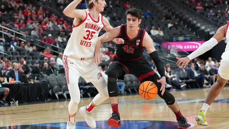 Mar 8, 2023; Las Vegas, NV, USA; Stanford Cardinal forward Maxime Raynaud (42) dribbles against Utah Utes center Branden Carlson (35) during the first half at T-Mobile Arena. Mandatory Credit: Stephen R. Sylvanie-USA TODAY Sports
