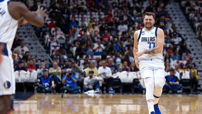 Mar 8, 2023; New Orleans, Louisiana, USA; Dallas Mavericks guard Luka Doncic (77) reacts as he passes the ball to forward Tim Hardaway Jr. (11) against the New Orleans Pelicans during the first half at Smoothie King Center. Mandatory Credit: Stephen Lew-USA TODAY Sports