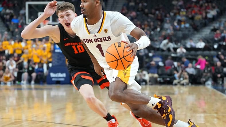 Mar 8, 2023; Las Vegas, NV, USA; Arizona State Sun Devils guard Luther Muhammad (1) dribbles against Oregon State Beavers forward Tyler Bilodeau (10) during the first half at T-Mobile Arena. Mandatory Credit: Stephen R. Sylvanie-USA TODAY Sports