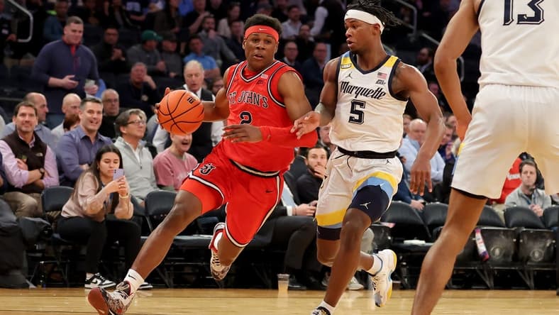 Mar 9, 2023; New York, NY, USA; St. John's Red Storm guard AJ Storr (2) drives to the basket against Marquette Golden Eagles guard Chase Ross (5) during the first half at Madison Square Garden. Mandatory Credit: Brad Penner-USA TODAY Sports