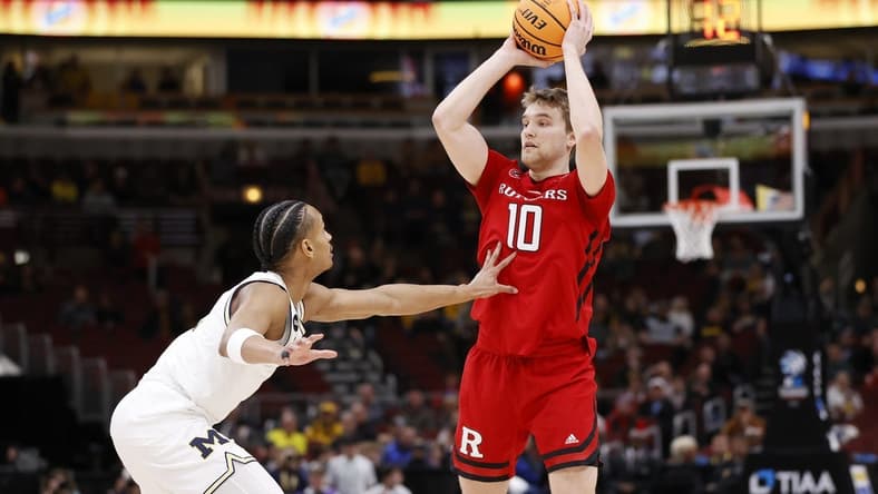 Mar 9, 2023; Chicago, IL, USA; Rutgers Scarlet Knights guard Cam Spencer (10) looks to pass the ball against Michigan Wolverines guard Kobe Bufkin (2) during the first half at United Center. Mandatory Credit: Kamil Krzaczynski-USA TODAY Sports