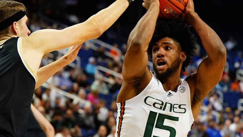 Mar 9, 2023; Greensboro, NC, USA; Miami (Fl) Hurricanes forward Norchad Omier (15) moves the ball into the lane against the Wake Forest Demon Deacons during the first half of the quarterfinals of the ACC tournament at Greensboro Coliseum. Mandatory Credit: John David Mercer-USA TODAY Sports