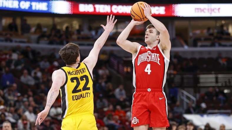 Mar 9, 2023; Chicago, IL, USA; Ohio State Buckeyes guard Sean McNeil (4) shoots against Iowa Hawkeyes forward Patrick McCaffery (22) during the first half at United Center. Mandatory Credit: Kamil Krzaczynski-USA TODAY Sports