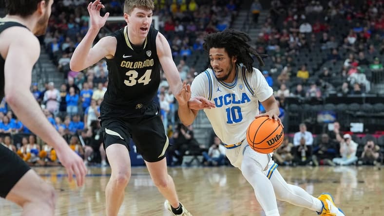 Mar 9, 2023; Las Vegas, NV, USA; UCLA Bruins guard Tyger Campbell (10) dribbles against Colorado Buffaloes center Lawson Lovering (34) during the first half at T-Mobile Arena. Mandatory Credit: Stephen R. Sylvanie-USA TODAY Sports