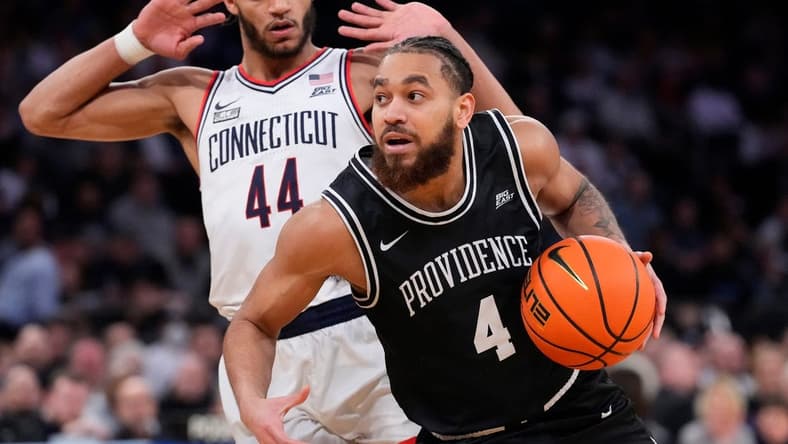 Mar 9, 2023; New York, NY, USA;  Providence Friars guard Jared Bynum (4) drives on Connecticut Huskies guard Andre Jackson Jr. (44) in the second half at Madison Square Garden. Mandatory Credit: Robert Deutsch-USA TODAY Sports
