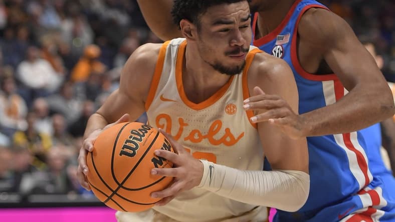 Mar 9, 2023; Nashville, TN, USA; Mississippi Rebels forward Jaemyn Brakefield (4) guards Tennessee Volunteers forward Olivier Nkamhoua (13) during the second half at Bridgestone Arena. Mandatory Credit: Steve Roberts-USA TODAY Sports