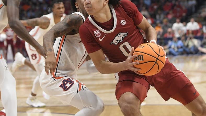 Mar 9, 2023; Nashville, TN, USA; Arkansas Razorbacks guard Anthony Black (0) drives ti the basket against the Auburn Tigers during the first half at Bridgestone Arena. Mandatory Credit: Steve Roberts-USA TODAY Sports